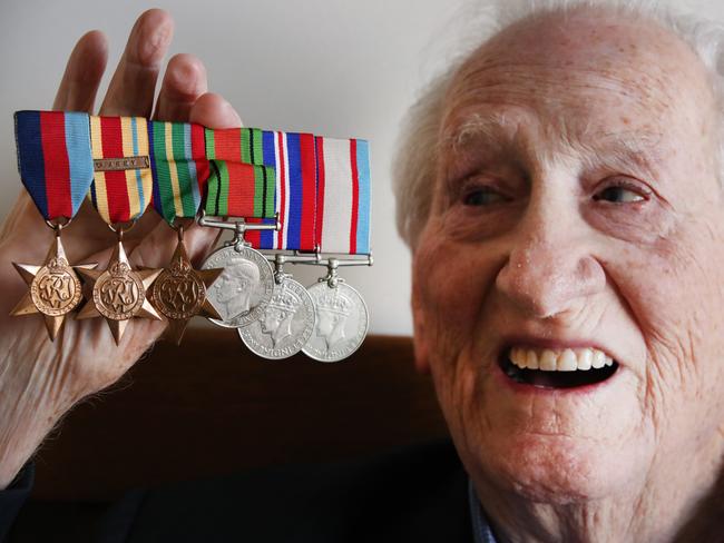 World War II veteran Keith Arneman, who recently celebrated his 100th birthday, with his medals. Picture: Glenn Hampson.