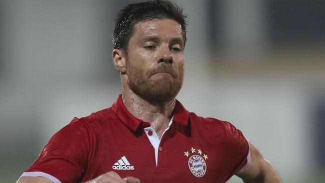 Bayern Munich's Xabi Alonso controls the ball.