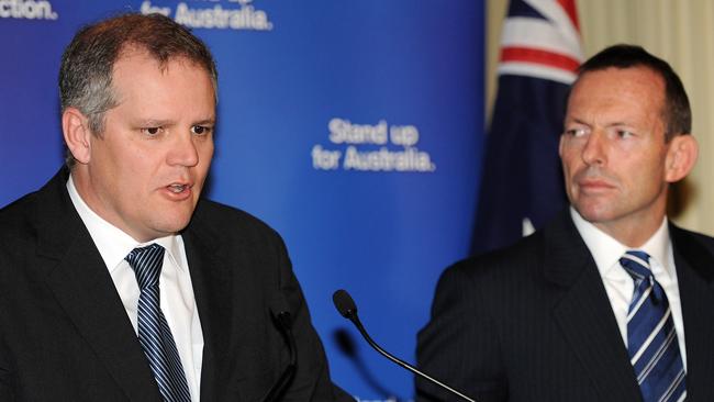 (FILES) A file photo taken in Sydney on August 10, 2010, shows Australia's former prime minister Tony Abbott (R) and Australia'a new treasurer Scott Morrison (L). Morrison, who was elevated to the high-profile post by new Prime Minister Malcolm Turnbull in a sweeping cabinet reshuffle despite voting for Abbott in last week's leadership contest, last week said he had warned his former leader's office they 