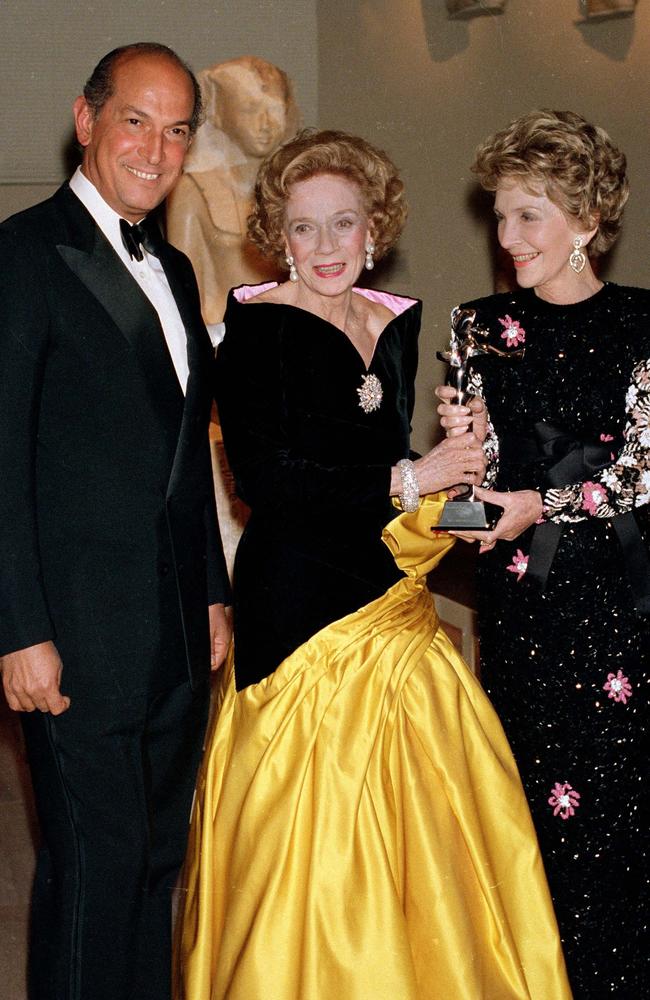 Former US First Lady Nancy Reagan (R), presenting philanthropist Brooke Astor with an award from the Council of Fashion Designers of America with designer Oscar de la Renta in 1988. Picture: AP PicEd/Bailey