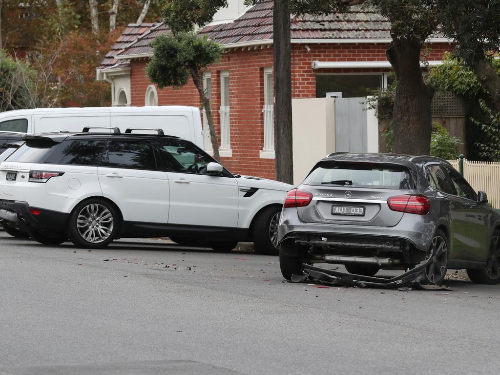 Damaged cars are seen on Wright street in Middle Park.