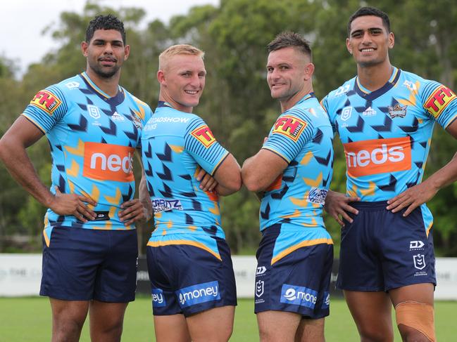 Gold Coast Titans players Treymain Spry, Tanah Boyd, Mitch Rein and Darius Farmer show off the club’s new shorts sponsor, emoney. Picture: Glenn Hampson