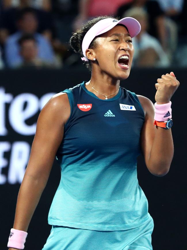 Osaka celebrates her win.