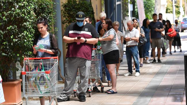 People line up outside Coles at Norwood on Wednesday. Picture: Keryn Stevens