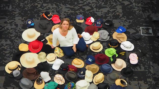 NSW Road Trauma Support Group member, Tania Brown, with some of the hats collected as part of a road safety campaign. Ms Brown lost her two children, aged 14 and 11, to road trauma in 2023.