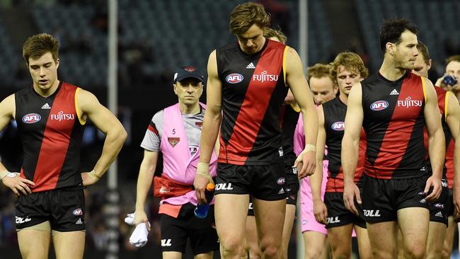 The Bombers walk off. (AAP Image/Tracey Nearmy)