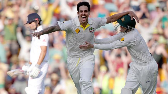 Mitchell Johnson celebrates after dismissing Jonathan Trott in Brisbane. Picture: Jono Searle.