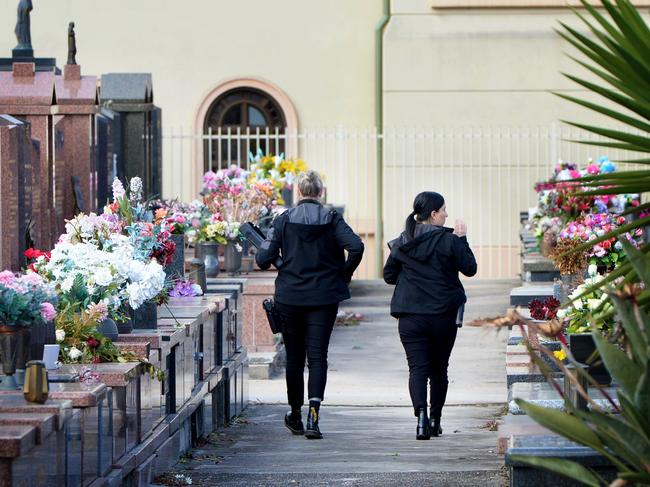 Police at Preston Cemetery investigating the vandal attack. Picture: Andrew Henshaw