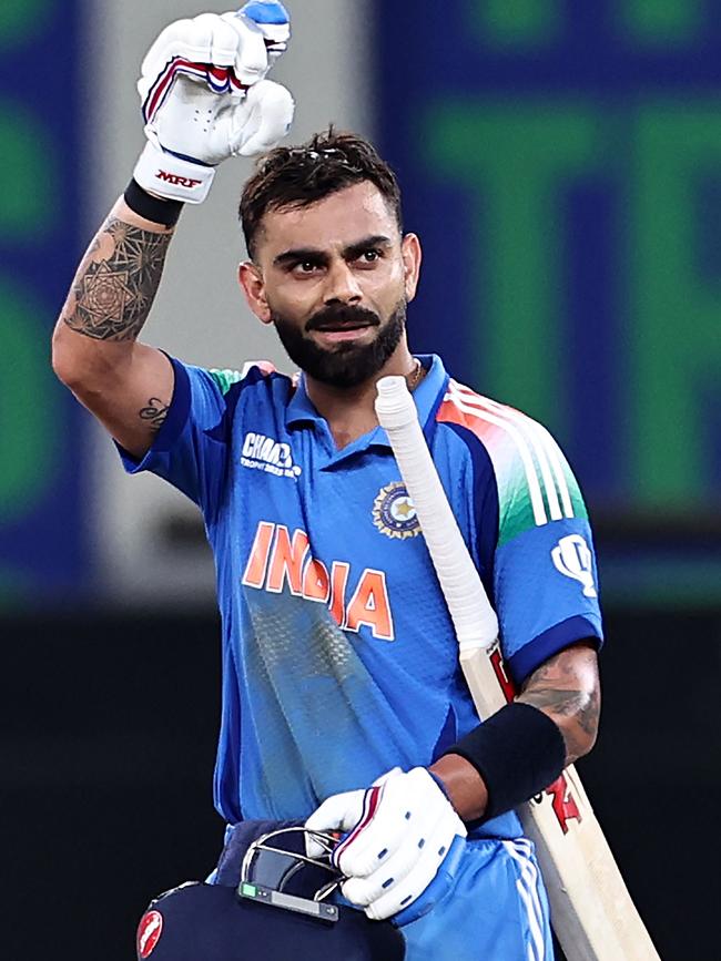 India's Virat Kohli celebrates after scoring a century against Pakistan. (Photo by FADEL SENNA / AFP)