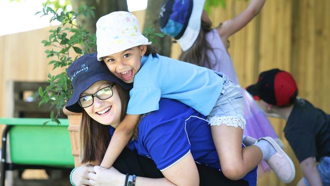 Courtney Cole poses with Kaci Daya, 5, at Nottingham World of Learning in Calamvale. Picture: Claudia Baxter