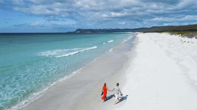 Summer is the perfect time to stroll on a beach – like Friendly Beaches, in Freycinet National Park. Picture: Stu Gibson