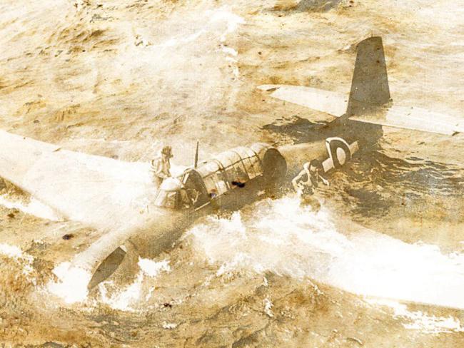 Crew evacuate an Avenger bomber that has crash-landed in the sea. Source: Imperial War Museum