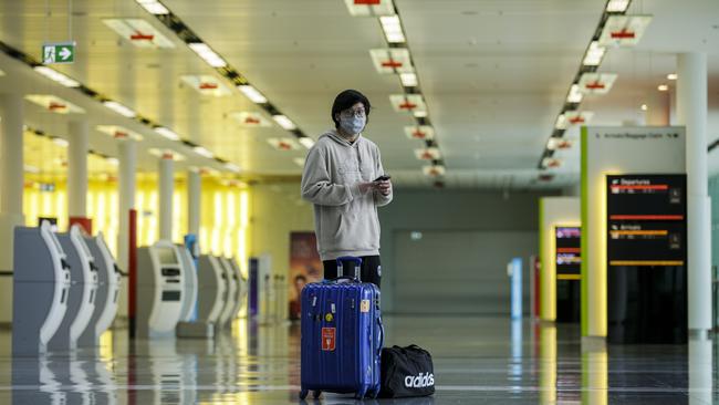 Marvel Wijaya, 19, a university student from Indonesia at Canberra Airport awaiting a flight to Sydney. Picture: Sean Davey.