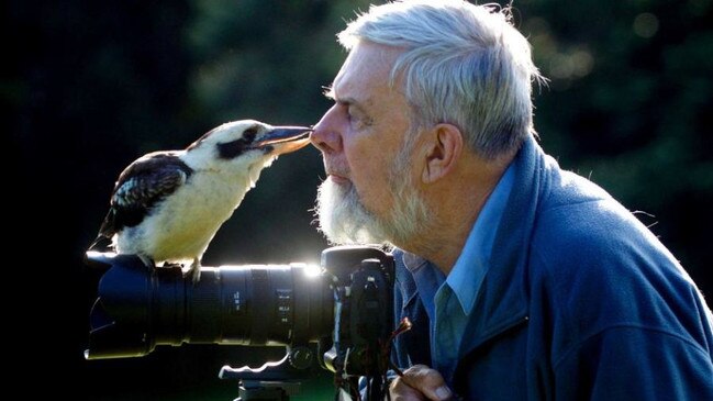 Martin Jacka has his nose tweaked by a kookaburra in this self-portrait. Jacka used a second camera to take the photograph after getting to know a group of five kookaburras near his Dunoon home in NSW. SOURCE: Supplied, by the family