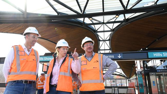 Sydney Metro workers (left to right) Andrew Knispel, Kirsten Evans and David Saggerson outside the completed Hills Showground train station. Picture: Tracey Nearmy/Daily Telegraph