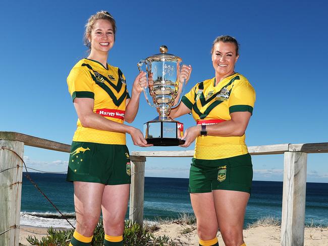 Australian Jillaroos Kezie Apps and Ruan Sims hold the World Cup they hope to claim at the tournament starting Thursday.