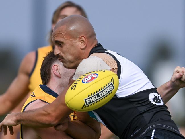 ADELAIDE, AUSTRALIA – FEBRUARY 23: Mark Keane of the Crows tackled by Willie Rioli of the Power and Sam Powell-Pepper of the Power causing a concussion during an AFL practice match between Port Adelaide Power and Adelaide Crows at Alberton Oval on February 23, 2024 in Adelaide, Australia. (Photo by Mark Brake/Getty Images)