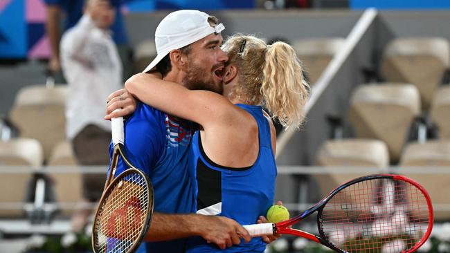 They embraced on the court after the win. Picture: Miguel Medina/AFP