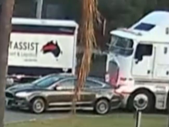 Horror footage has captured the moment a Sydney mother was struck and killed by a truck in front of her son on Wednesday morning., , The vision shows Leonia Picone, 55, get out of the passenger seat of the Ford Mondeo sedan her L-plate son was driving aftera truck rear-ended them, forcing the car off the road in Wetherill Park.  Picture: 7NEWS