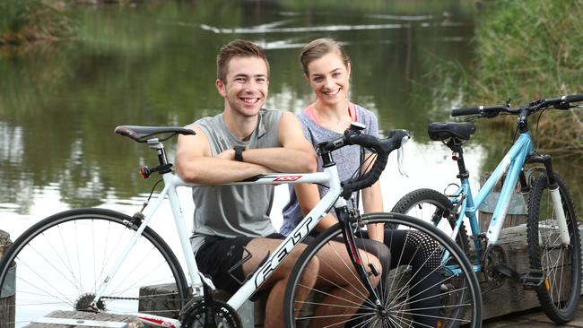 Keen cyclists Peter Mitchell, 20, and Chelsea Malcolm, 19, riding along a path at Lockleys. Picture: Tait Schmaal