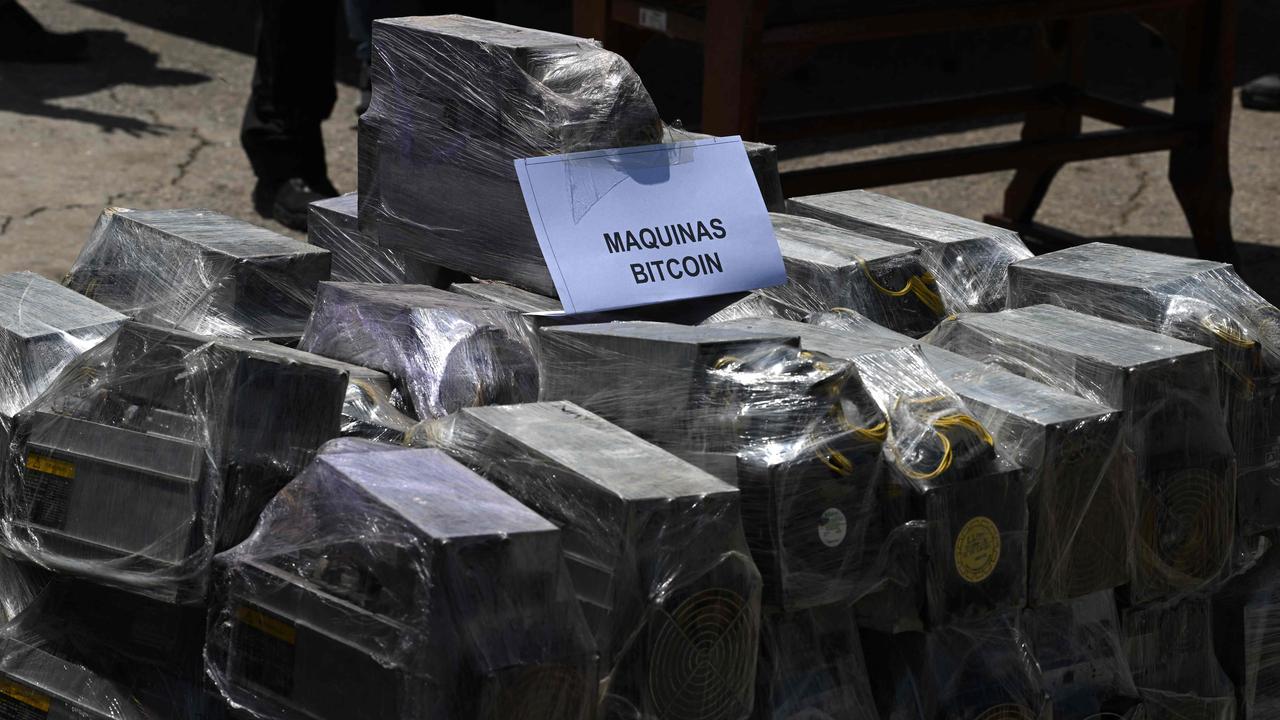 Bitcoin mining machines were also confiscated. Picture: Yuri Cortez/AFP