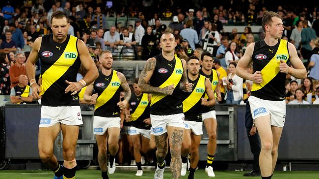 Dustin Martin with Tigers teammates. Photo by Dylan Burns/AFL Photos via Getty Images.