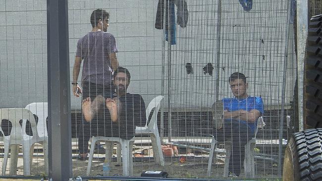 Behind the wire: detainees inside the Manus Island asylum-seeker detention centre. Picture: Brian Cassey.