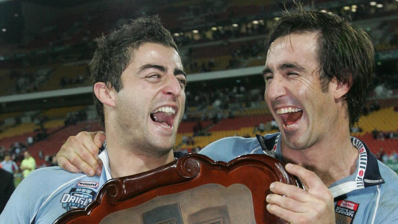 Anthony Minichiello shares a laugh with Andrew Johns after the Blues won the 2005 series decider at Suncorp Stadium.