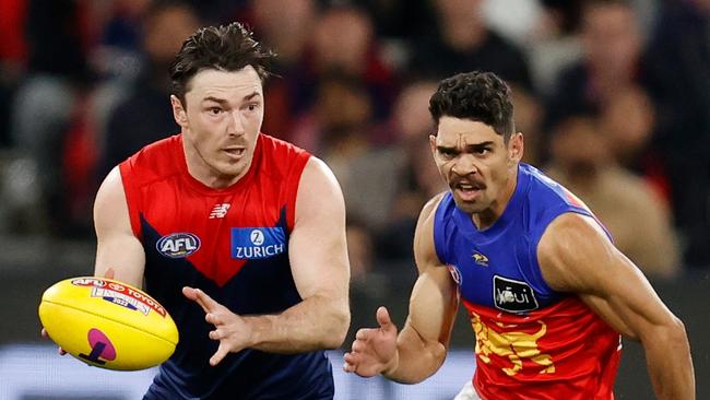 Michael HIbberd evades Charlie Cameron.