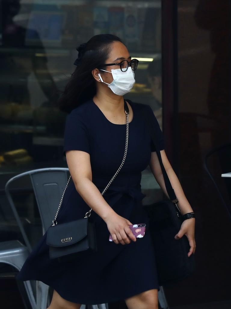 As smoke from bushfires engulfs Sydney, morning commuters are pictured wearing face masks as they make their way to work. Picture: MATRIX