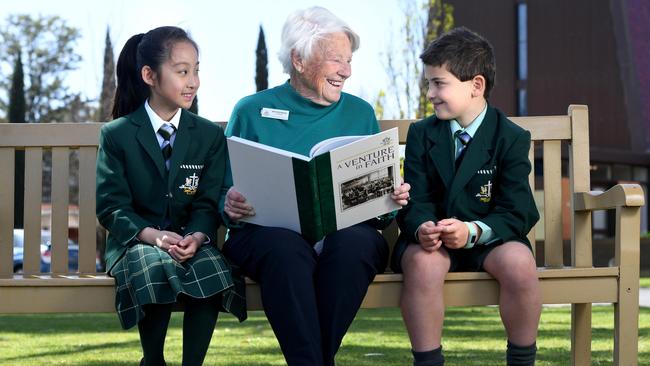 Nita Doddridge, 87, is retiring from volunteering at Westminster School. She is pictured with students Katherine and Kai. Picture: Tricia Watkinson