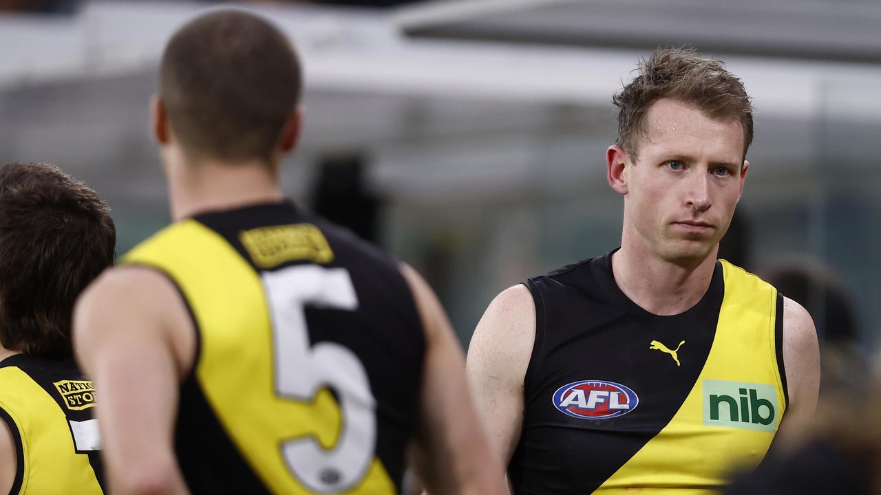 MELBOURNE, AUSTRALIA - JULY 31: Dylan Grimes of the Tigers is seen on the bench during the round 20 AFL match between the Richmond Tigers and the Brisbane Lions at Melbourne Cricket Ground on July 31, 2022 in Melbourne, Australia. (Photo by Darrian Traynor/Getty Images)