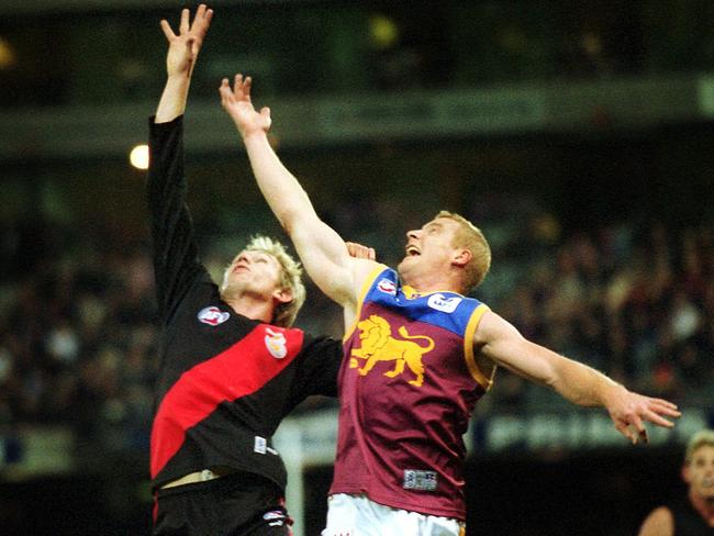 James Hird and Michael Voss battle for the ball.