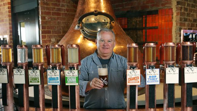 Manager Paul Flinn behind the bar at The Cheeky Squire. Picture: David Crosling