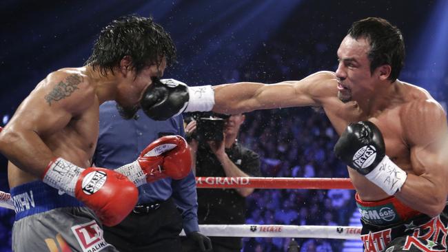 Juan Manuel Marquez lands a knockout blow to the head of Manny Pacquiao in their 2012 fight.