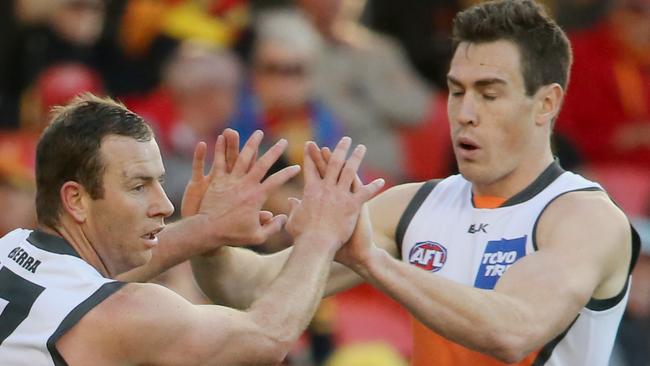 The Gold Coast Suns Vs the GWS Giants at Metricon Stadium. Jeremy Cameron (left) celebrates a goal . Pic Jono Searle.