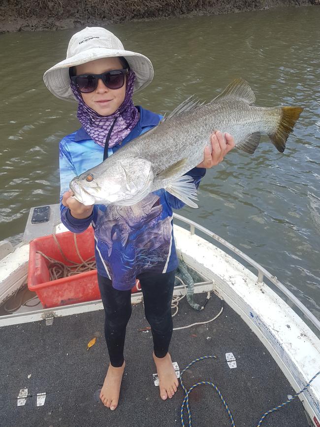 Jack Bennett showing off a great barra catch.