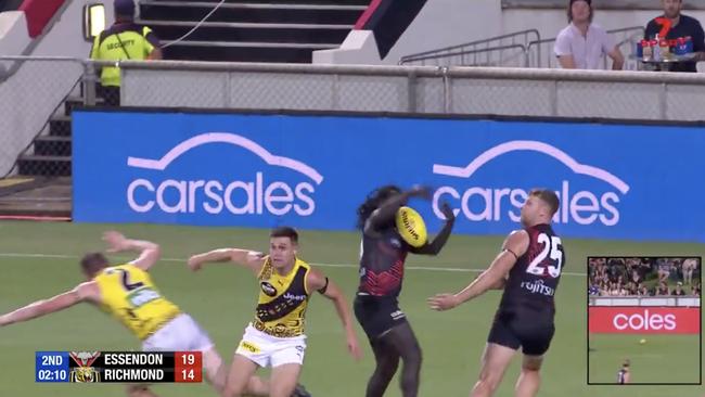 Essendon fans were left fuming after Dylan Grimes put a bit of mayo on a dive to ensure a free kick. Screenshot: Seven AFL