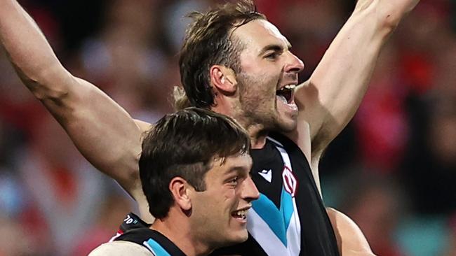 Jeremy Finlayson celebrates kicking a goal with teammates during the round four AFL match between Sydney Swans and Port Adelaide Power at Sydney Cricket Ground. (Photo by Cameron Spencer/Getty Images)