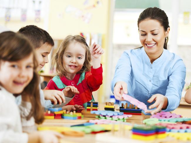 Generic photo of a childcare worker and children in a daycare centre