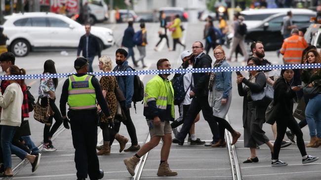 Passers-by on Bourke St after the incident. Picture: Ian Currie