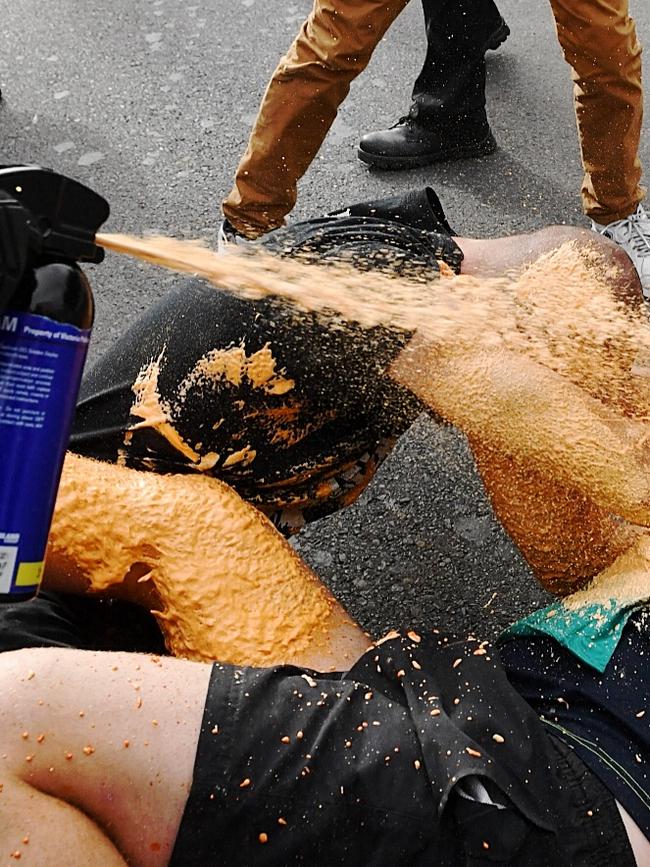 Police use pepper spray to quell the violence Picture: Jake Nowakowski