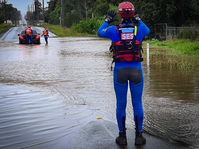 Penrith SES volunteers are seen assisting this car that has driven through flood waters. Picture: Penrith SES