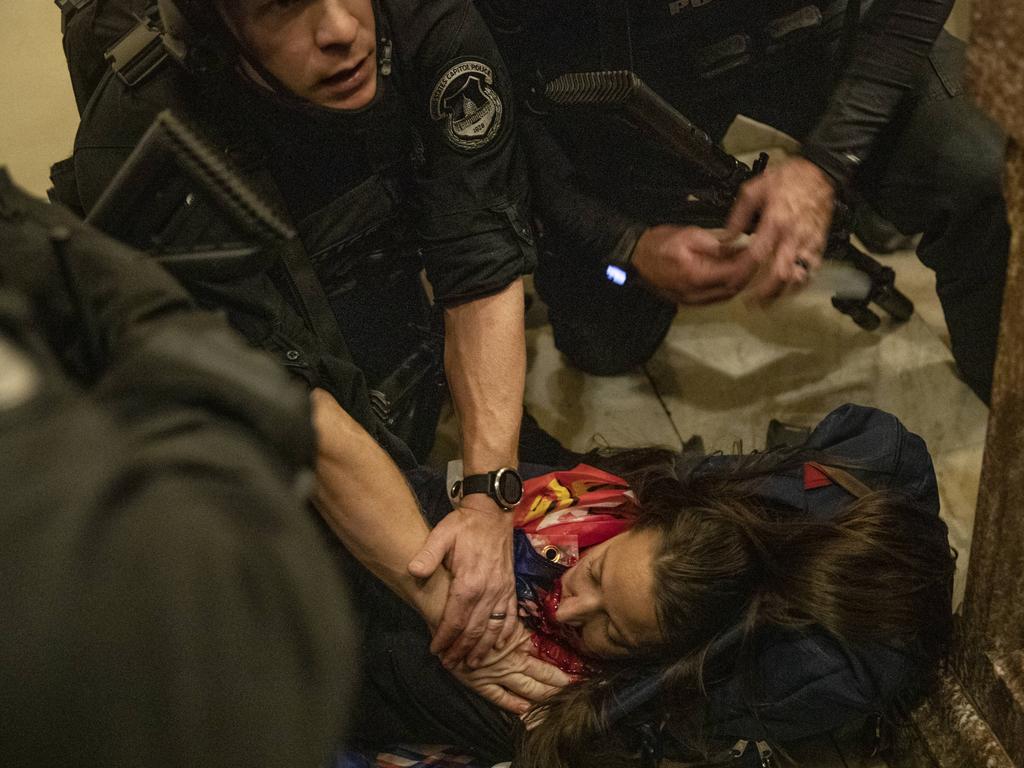 A woman lies on the ground after being shot during the protest at the US Capitol. Picture: Victor J. Blue/Bloomberg via Getty Images