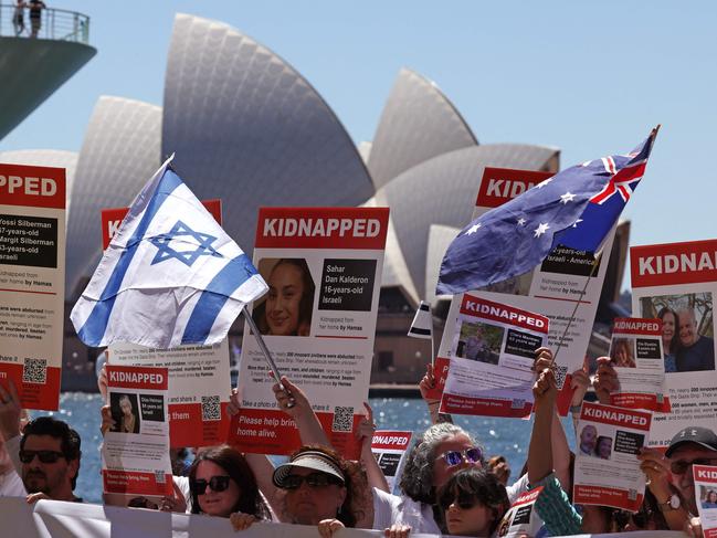 Members of the Australian Jewish community hold banners and placards in front of the Sydney Opera House during a more peaceful rally on October 29. Picture: AFP