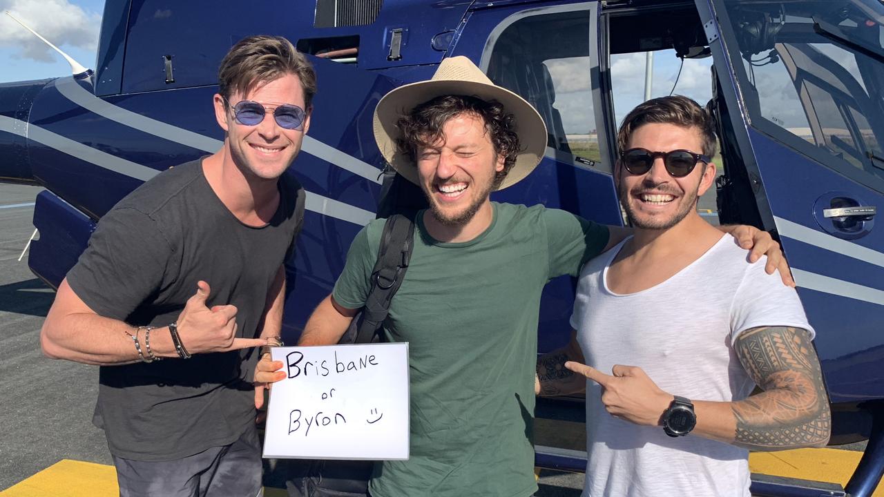 Chris Hemsworth (left) and Luke Zocchi (right) transported hitchhiker Scott Hildebrand (centre) from Brisbane to Byron Bay via an Avmin Air Charter private helicopter. Photo: Avmin Air Charter