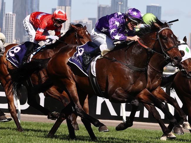 MELBOURNE. . Oaks Day. 04/11/2021.   Race 7 . The Melbourne Cup Carnival Country final .   Bermadez ridden by Damian Oliver (purple white stars) wins race 7  .  Photo by Michael Klein.