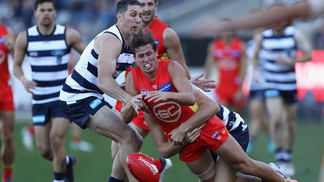 David Swallow loses the ball in a tackle.