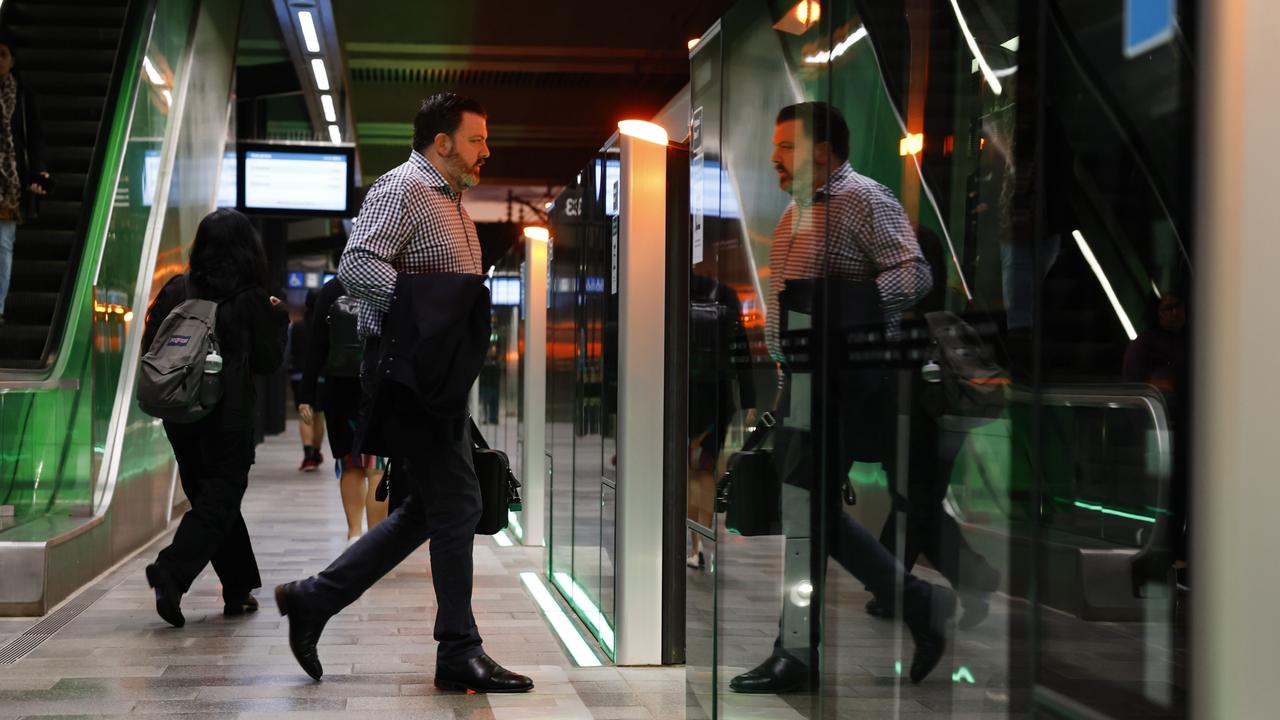 Pictured at Tallawong Station is a commuter boarding one of the first Sydney Metro trains on its way back in to the city. The brand new Sydney Metro had its maiden run to Tallawong leaving Sydenham Station at 4.54am. Picture: Richard Dobson