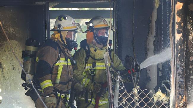 Firefighters at the scene of the house fire in Ashmore. Picture Glenn Hampson